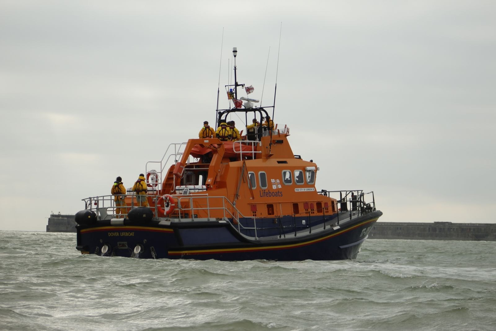An orange lifeboat under way in open water